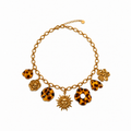Collier doré à pampilles soleil et effet écaille