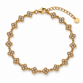 Bracelet doré à motifs trèfles scintillants